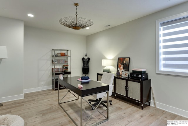 office featuring a healthy amount of sunlight and light wood-type flooring