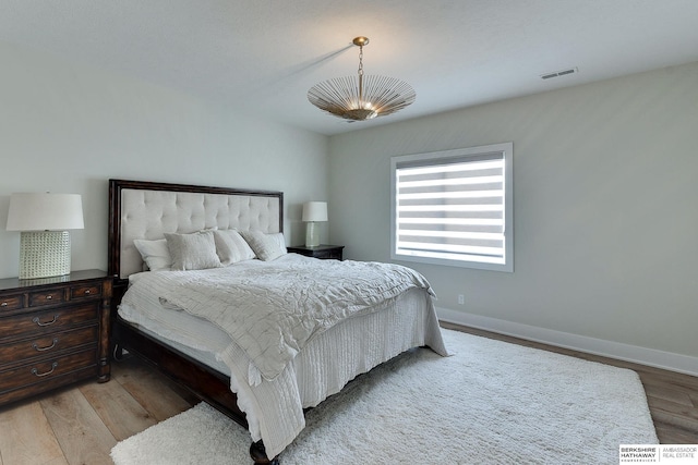 bedroom with light hardwood / wood-style floors