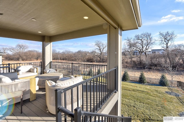 wooden deck featuring a yard and outdoor lounge area