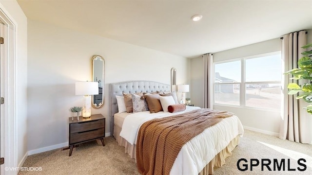 bedroom with light colored carpet