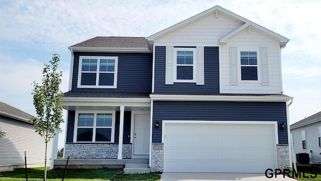 view of front of house featuring a garage and a porch