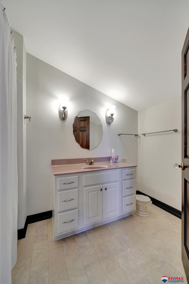 bathroom featuring vanity and baseboards