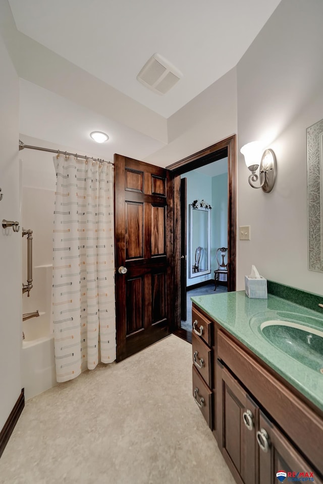 full bathroom featuring shower / tub combo, visible vents, and vanity