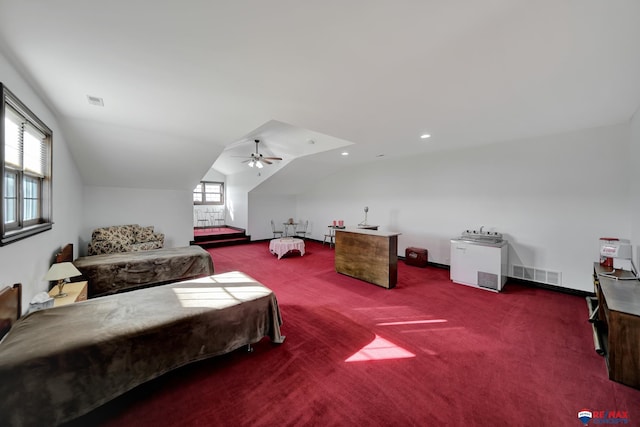 bedroom with lofted ceiling, ceiling fan, carpet flooring, and visible vents