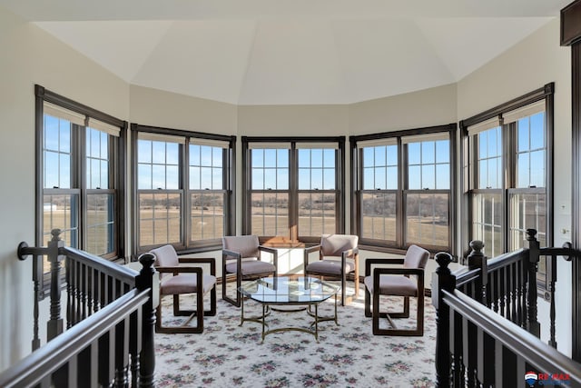 sunroom / solarium with a wealth of natural light and lofted ceiling