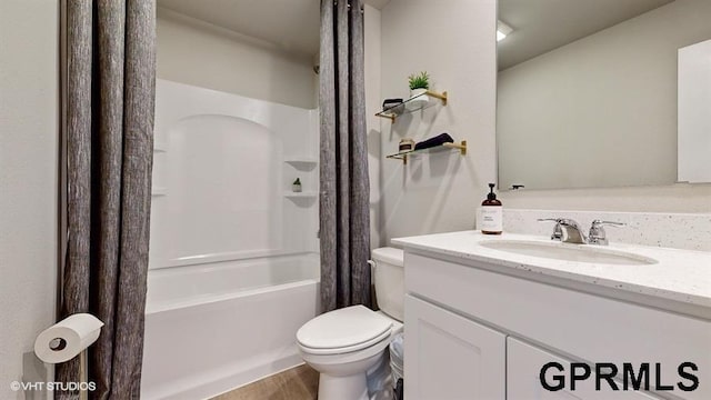 full bathroom featuring shower / tub combo, vanity, and toilet