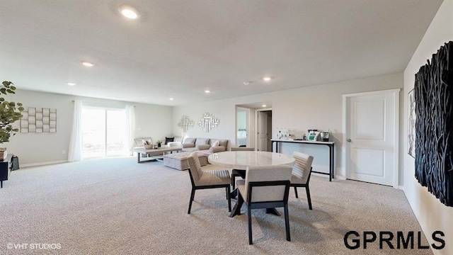 view of carpeted dining area