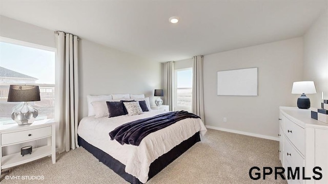 bedroom featuring light colored carpet