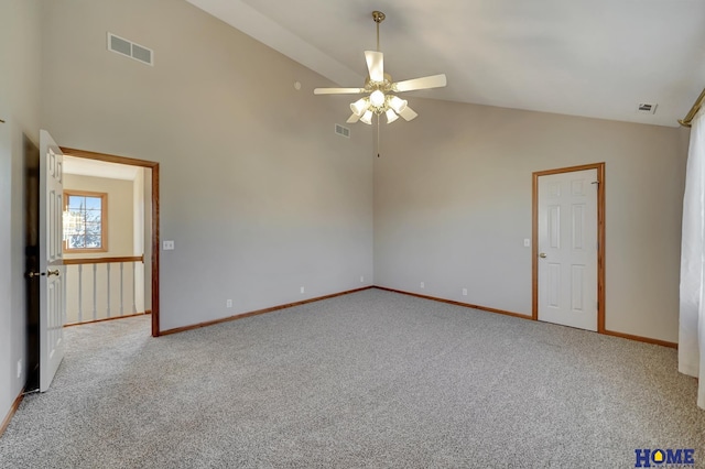 empty room featuring high vaulted ceiling, ceiling fan, and carpet flooring