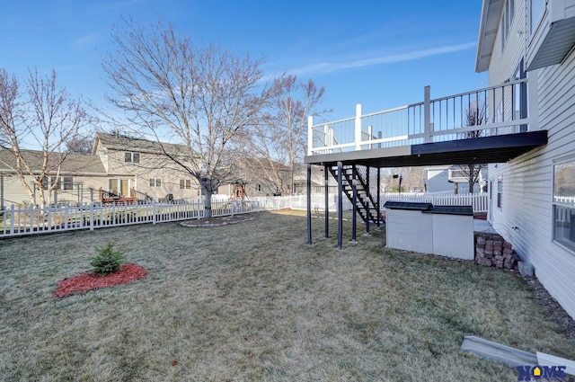 view of yard with a hot tub and a deck