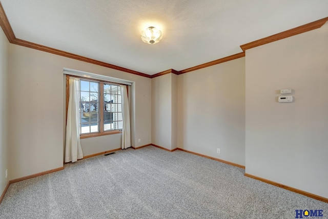 carpeted spare room with ornamental molding