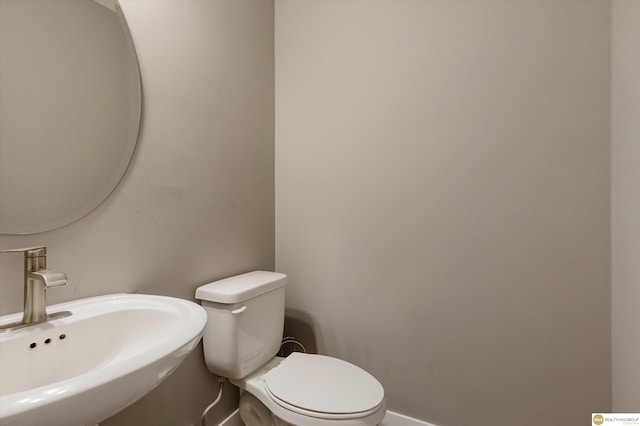 bathroom featuring sink and toilet