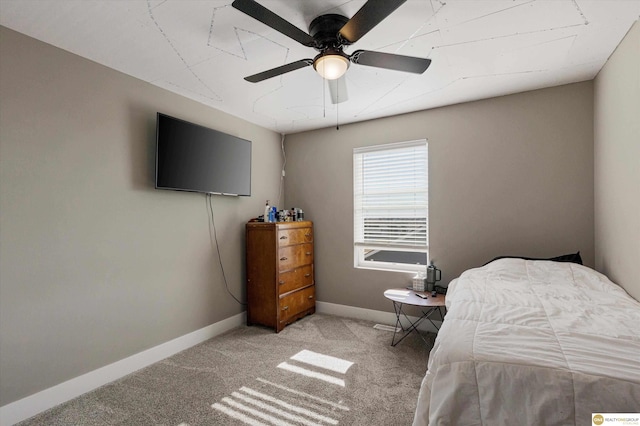 bedroom featuring ceiling fan and light carpet