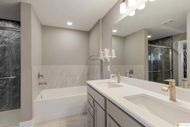 bathroom featuring vanity and separate shower and tub