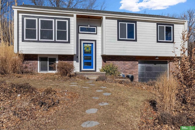 bi-level home featuring a garage