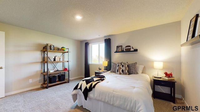 carpeted bedroom featuring a textured ceiling