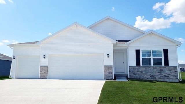 view of front of house with a garage and a front yard