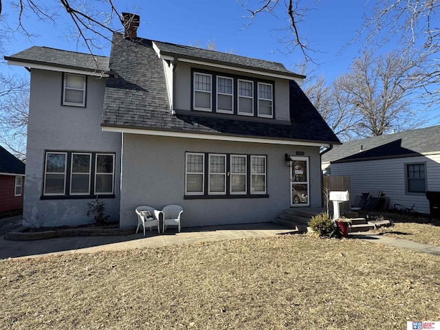 back of house featuring a patio area