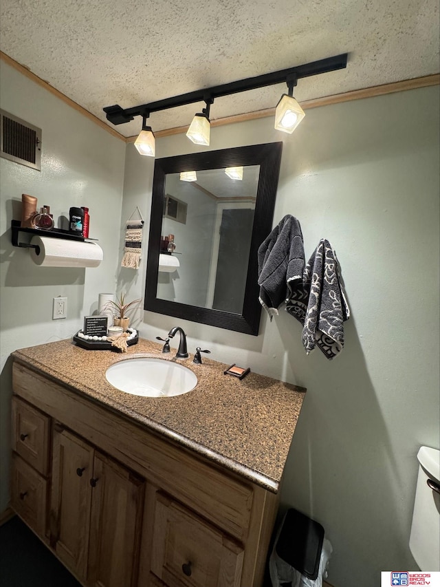 bathroom with vanity and a textured ceiling