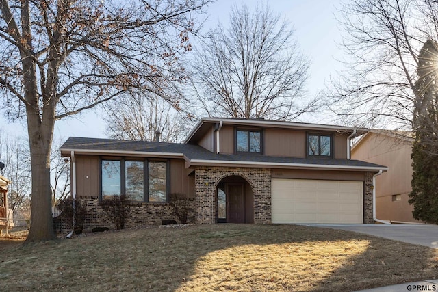 view of front of home featuring a garage and a front lawn