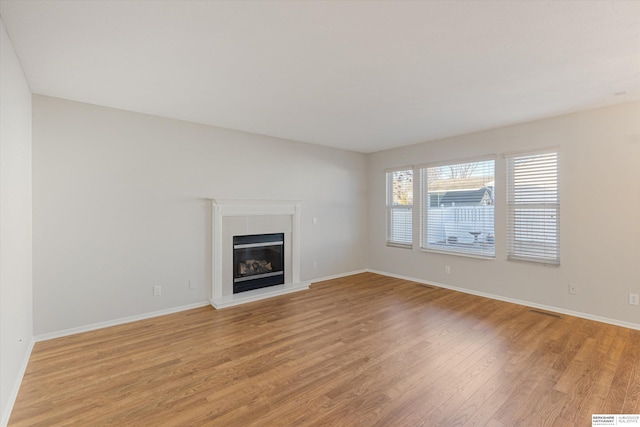 unfurnished living room with light hardwood / wood-style floors