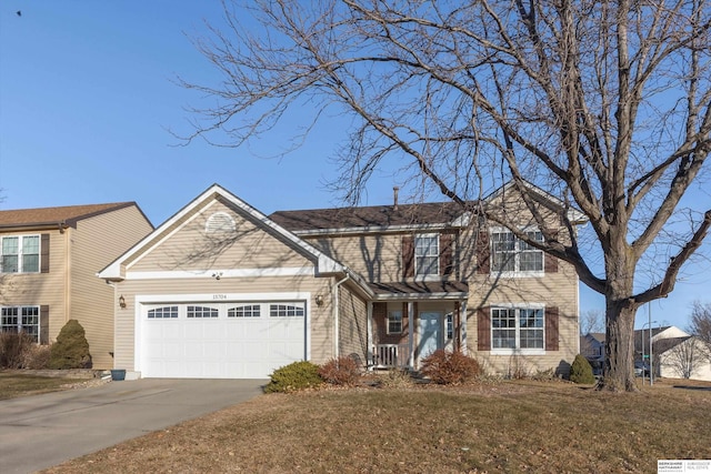 view of front of home with a garage and a front yard