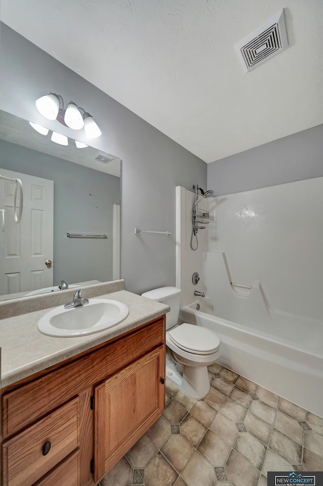 full bathroom with vanity, bathing tub / shower combination, and toilet