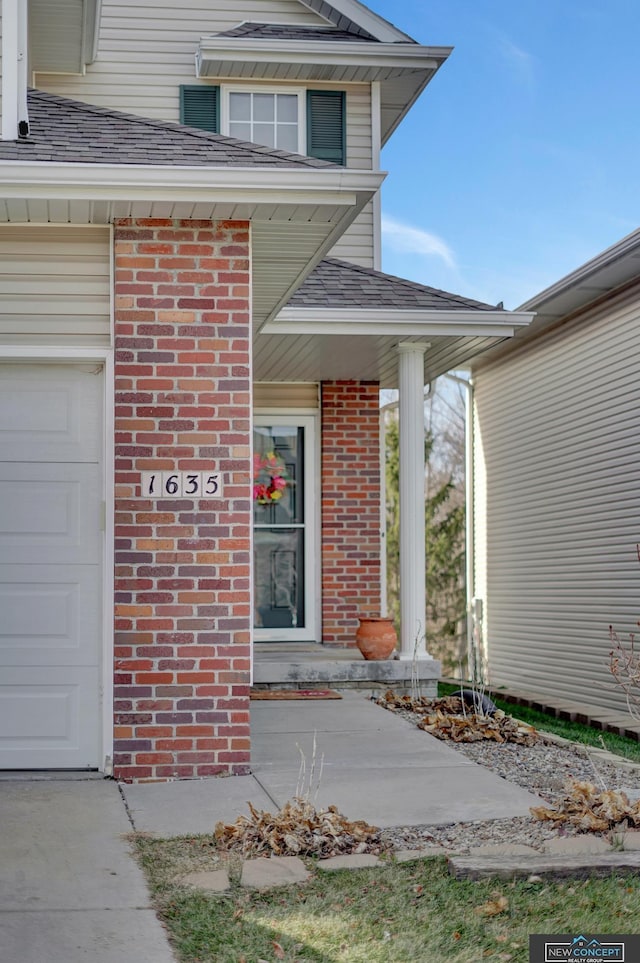 view of exterior entry featuring a garage