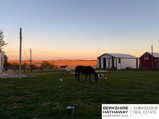 yard at dusk with an outdoor structure