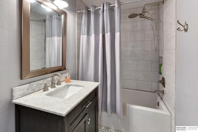 bathroom featuring shower / tub combo with curtain and vanity