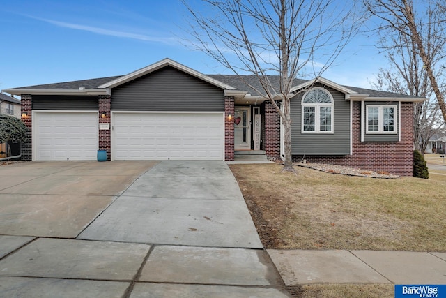 single story home with a garage and a front lawn