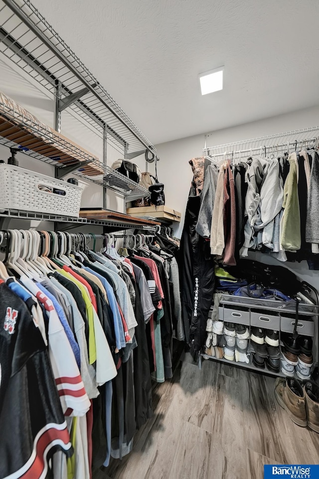 walk in closet featuring wood-type flooring