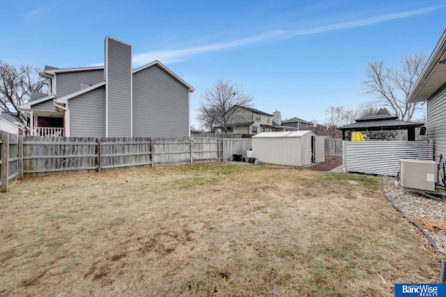 view of yard with a storage shed and a gazebo