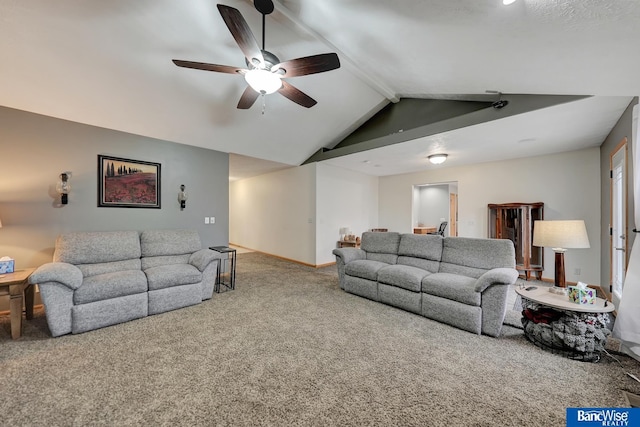 living room with ceiling fan, lofted ceiling with beams, and carpet