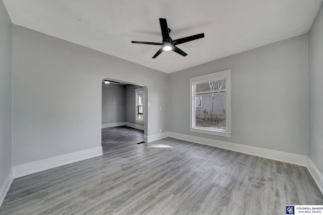 unfurnished room featuring ceiling fan and light hardwood / wood-style flooring