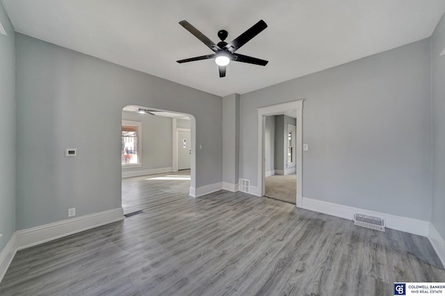 unfurnished room with light hardwood / wood-style floors and ceiling fan