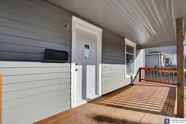 view of exterior entry featuring a porch