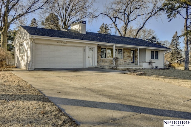 ranch-style house featuring a garage