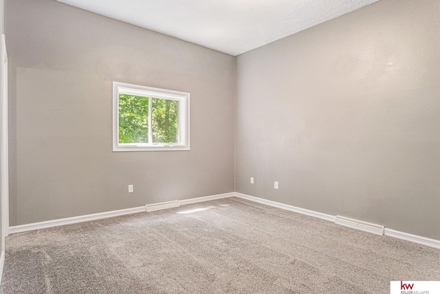 empty room featuring carpet flooring