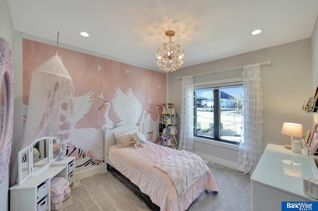 bedroom with a chandelier and light carpet