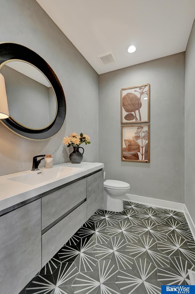 bathroom with vanity and toilet