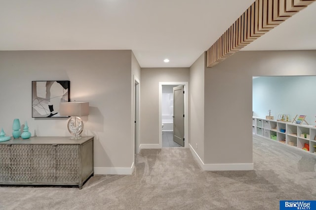 hallway with light carpet