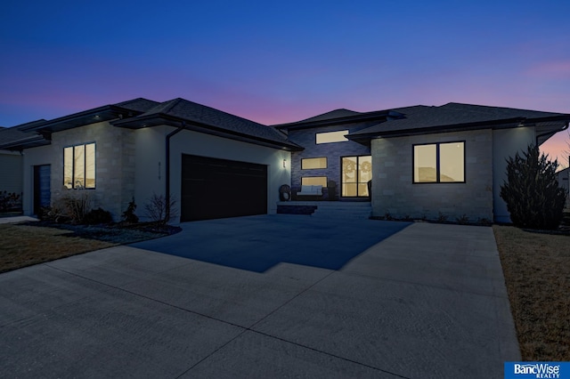 prairie-style house featuring a garage