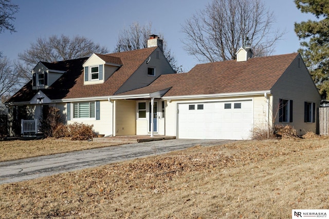 new england style home with a garage