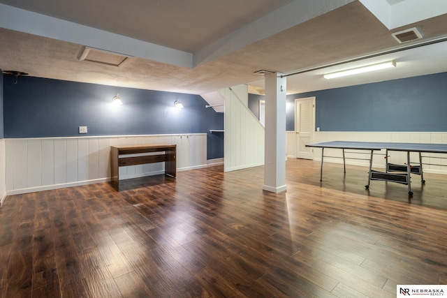 basement featuring dark hardwood / wood-style floors