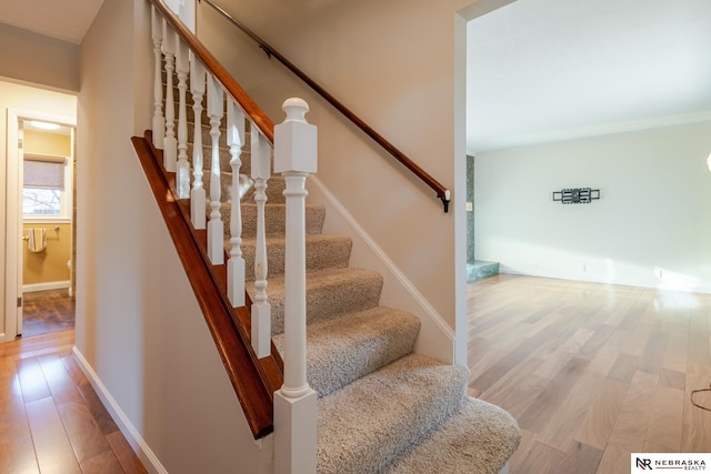 stairs with wood-type flooring