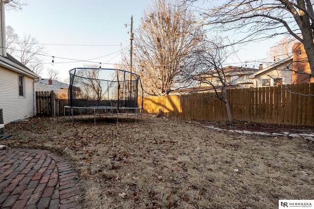 view of yard with a trampoline