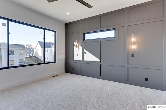 unfurnished bedroom with ceiling fan and light colored carpet