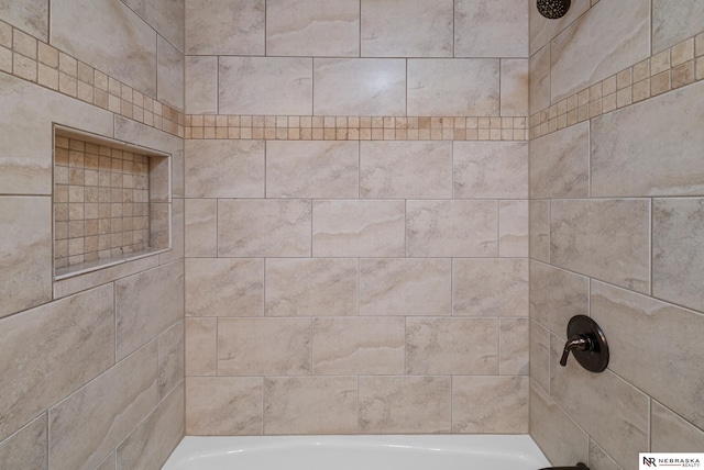 bathroom featuring tiled shower