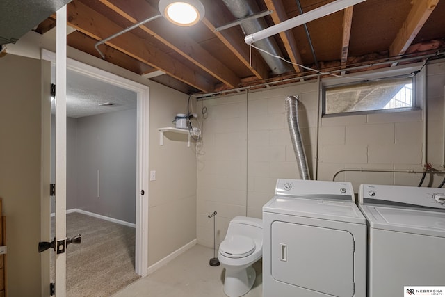 laundry area with washing machine and clothes dryer